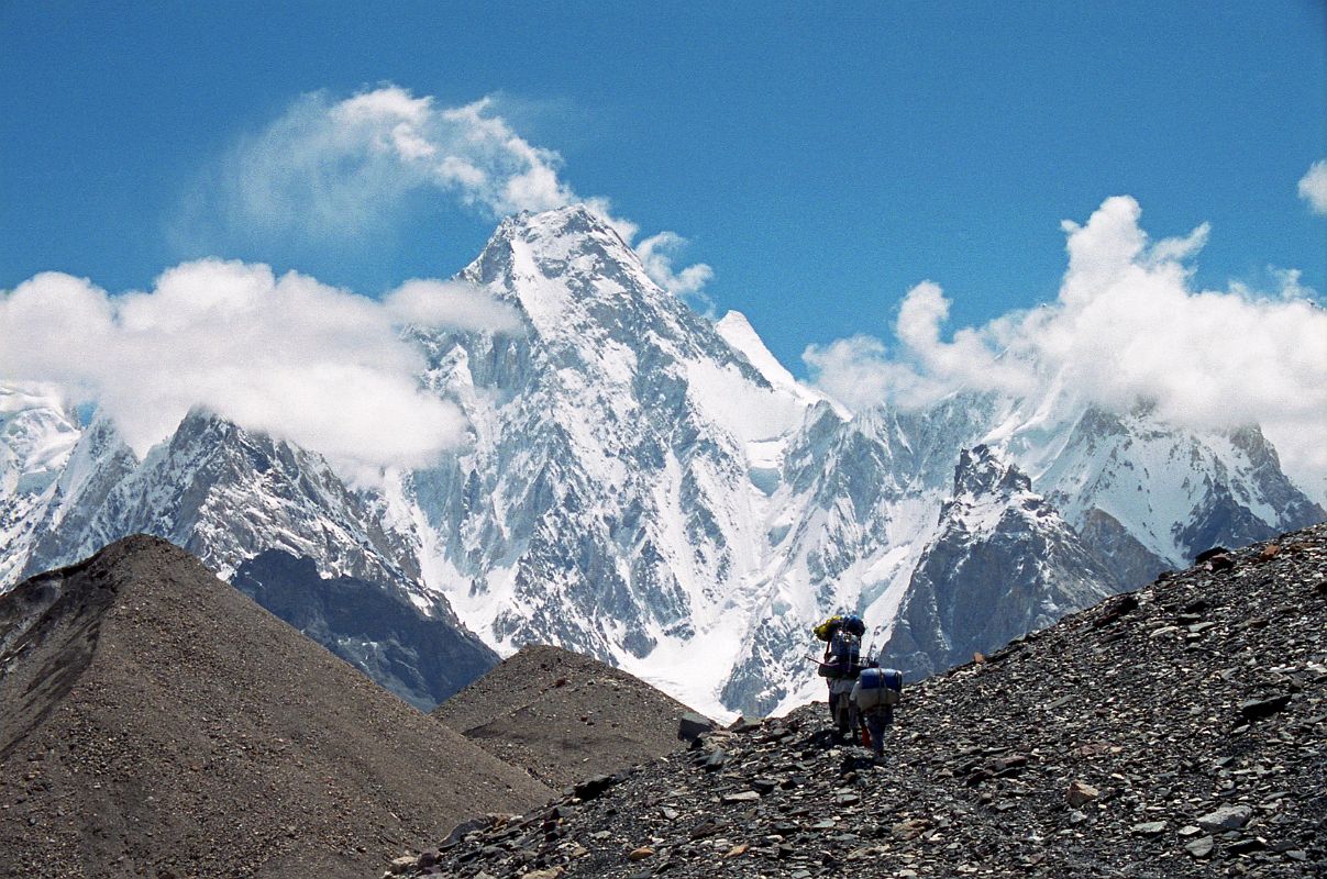 36 Porters Nearing Concordia With Gasherbrum IV Towering Overhead My porters are nearing Concordia with Gasherbrum IV towering overhead.